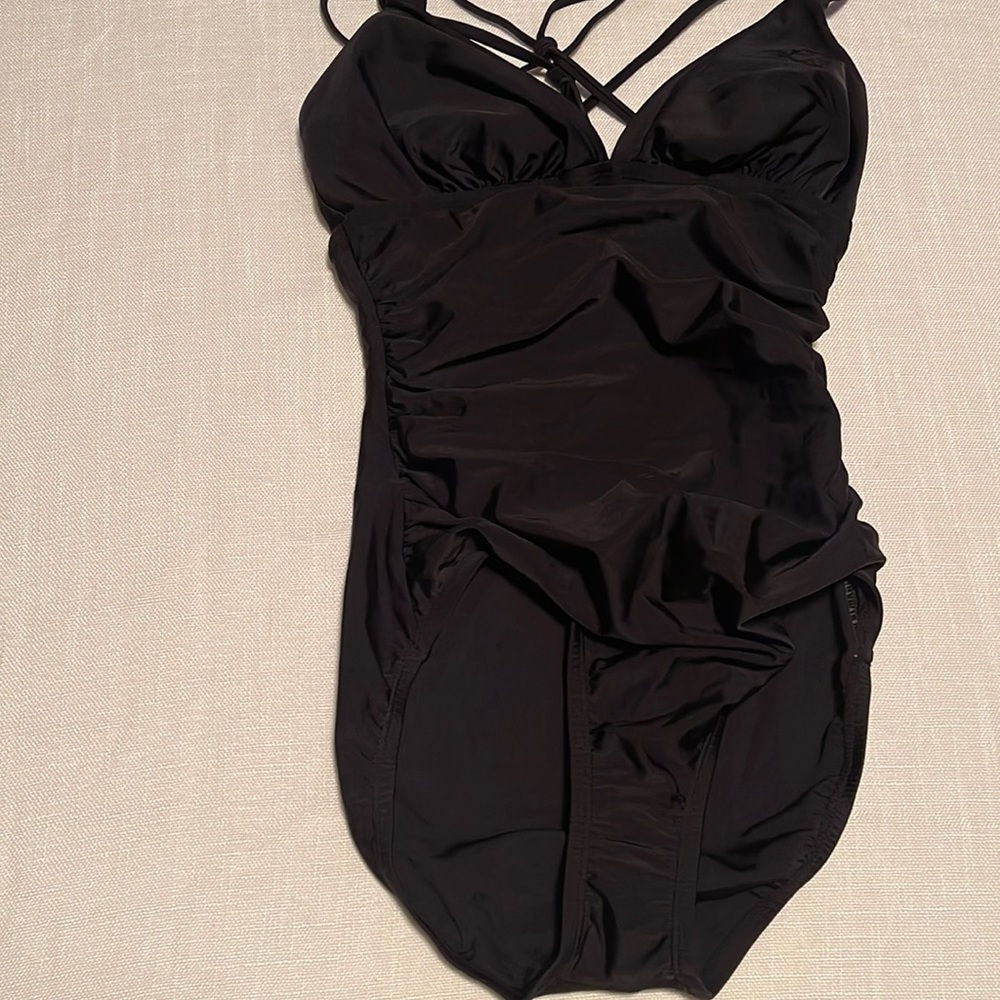 NEW. Size small one piece